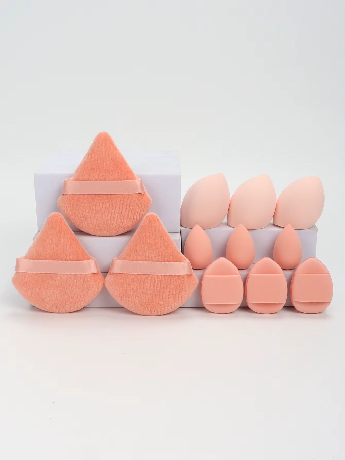 12-piece multi-purpose makeup sponge set, consisting of 3 loose powder puffs, 3 mini air cushion puffs, 3 beauty eggs, and 3 mini beauty sponges.