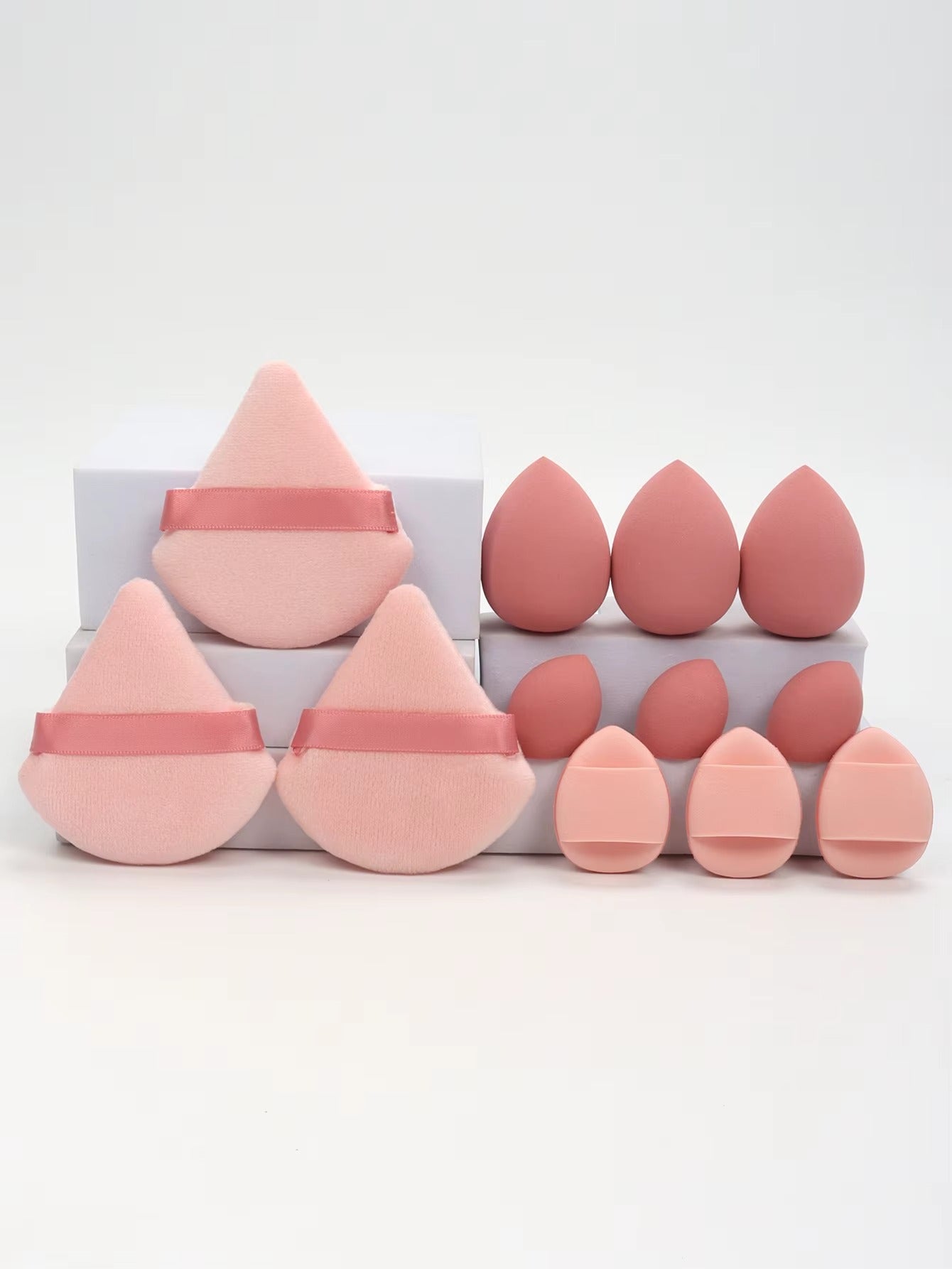 12-piece multi-purpose makeup sponge set, consisting of 3 loose powder puffs, 3 mini air cushion puffs, 3 beauty eggs, and 3 mini beauty sponges.
